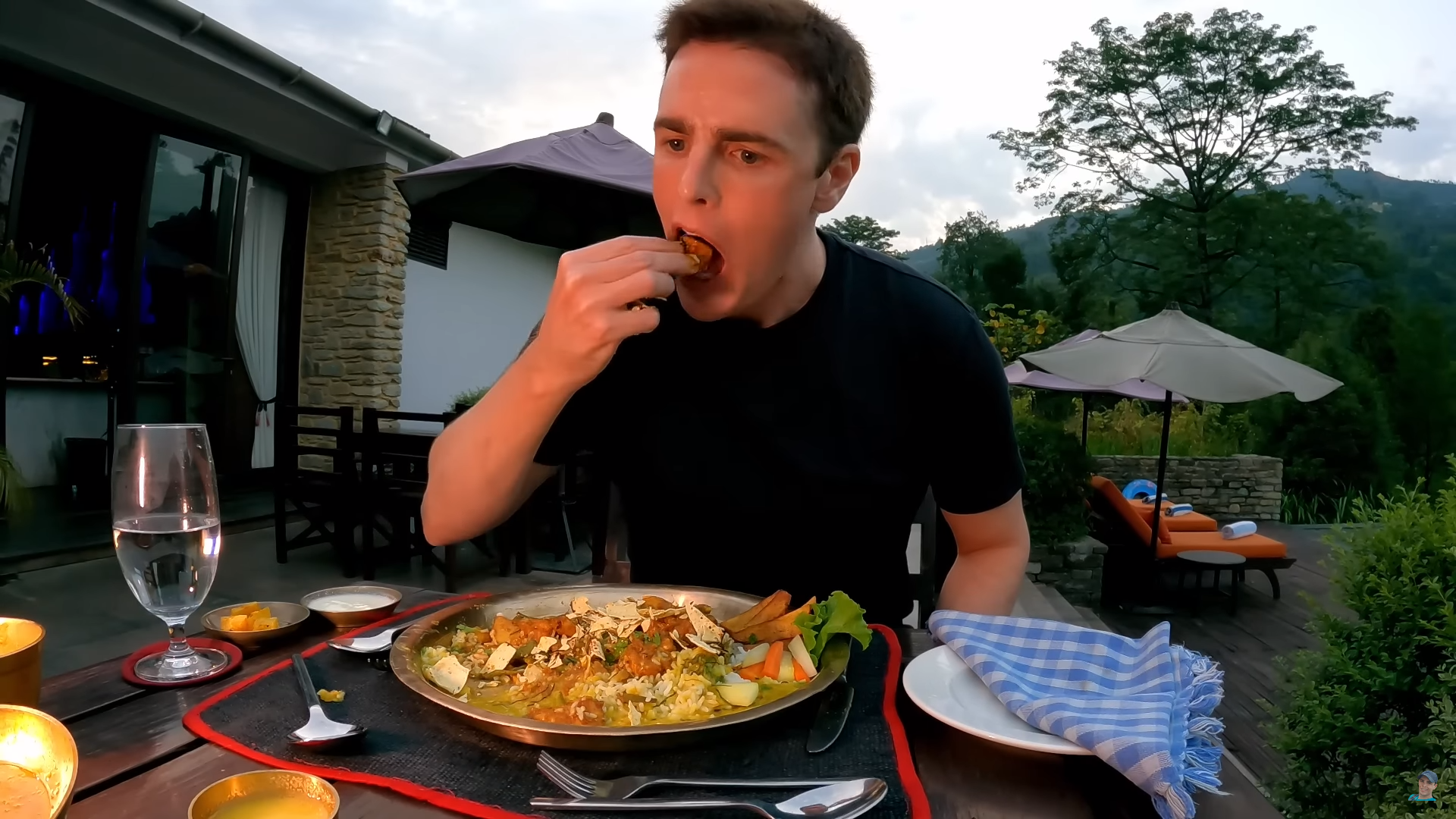 Popular travel vlogger Dale Philip savors a Nepali Dal Bhat Thali in Nepal.