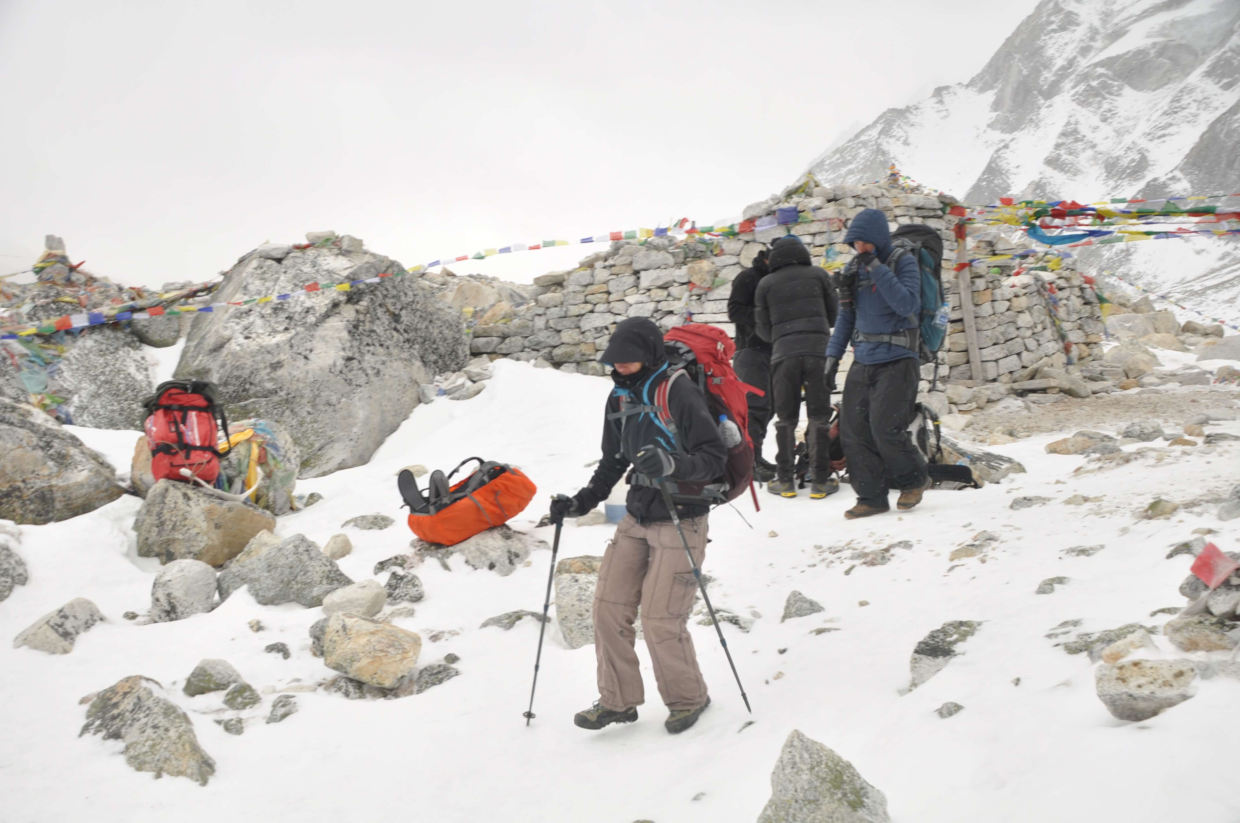 Trekkers walking on snow in the Manaslu Trek.