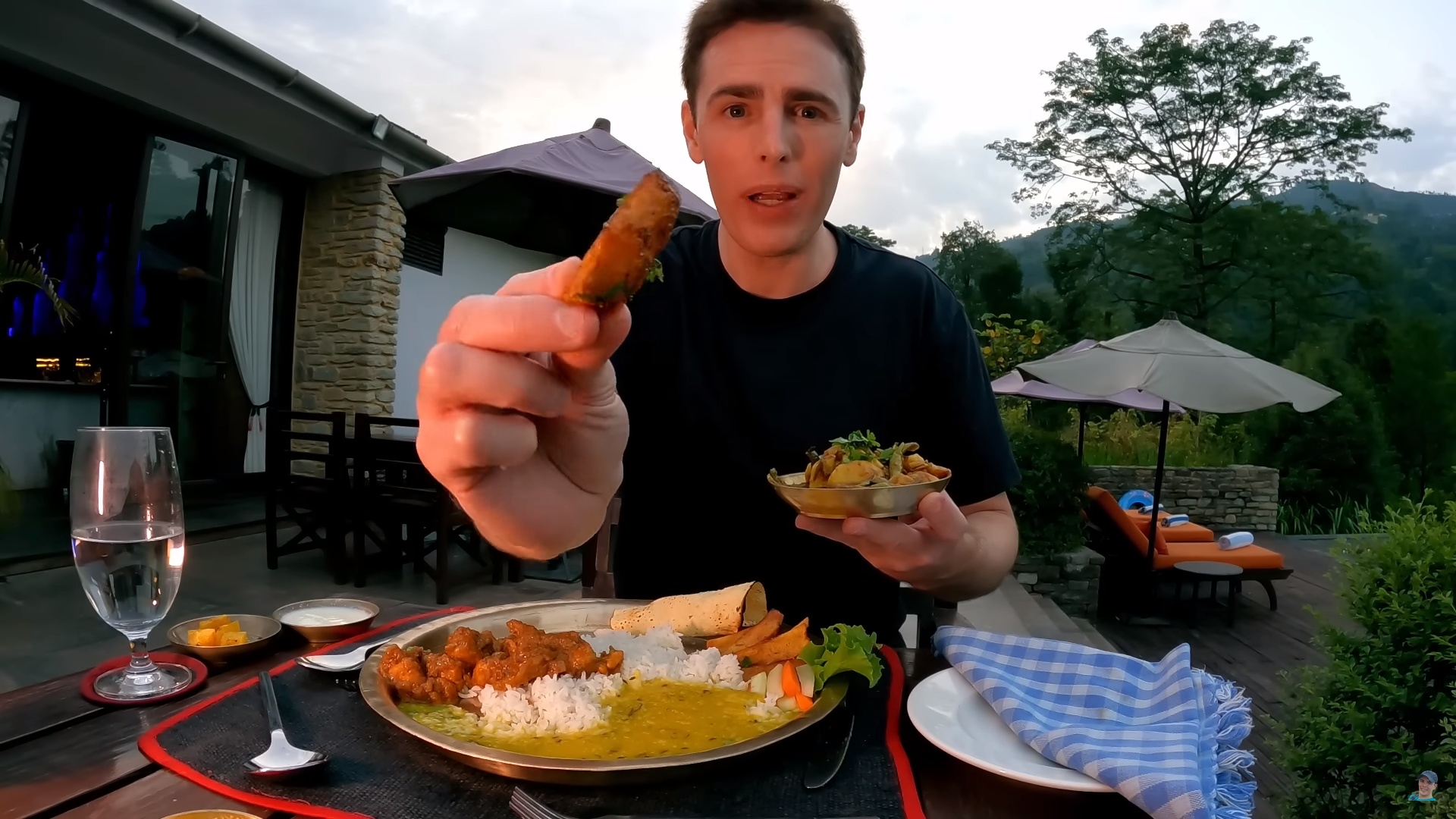 Travel vlogger Dale Philip savoring the classic Nepali Dal Bhat