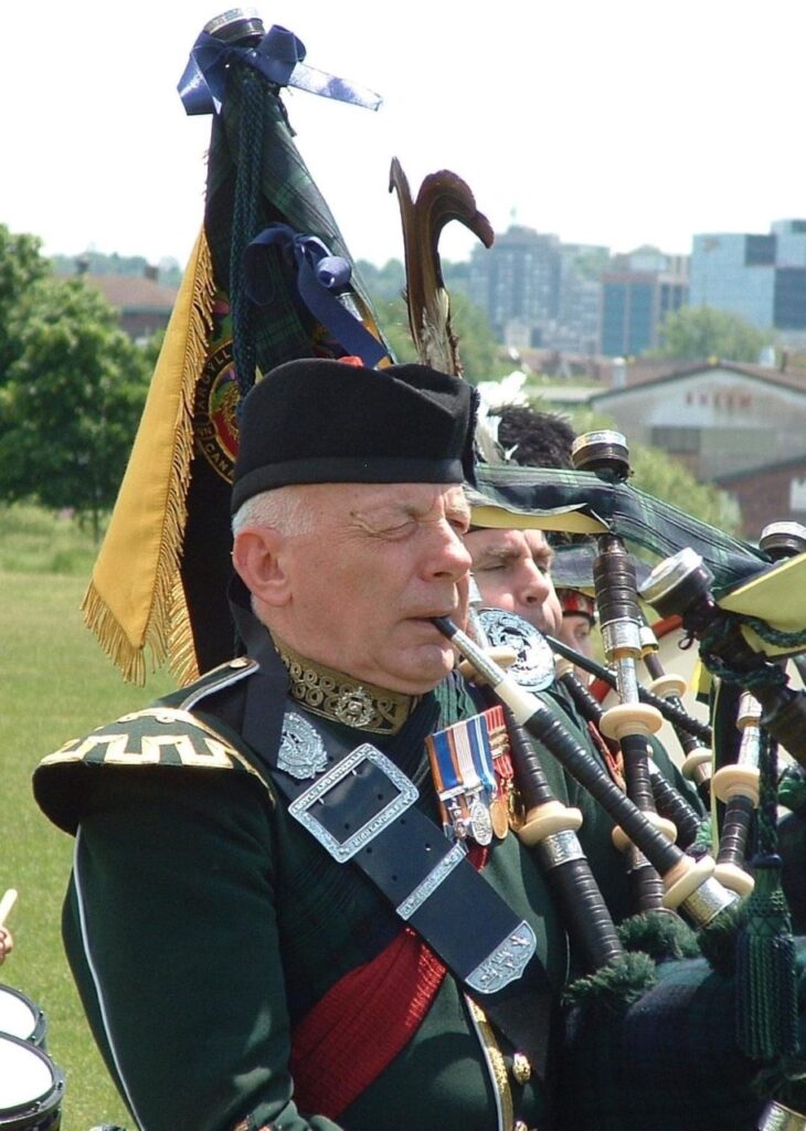 Pipe Major Emeritus John Terence, MMM, CD (1944–2021)