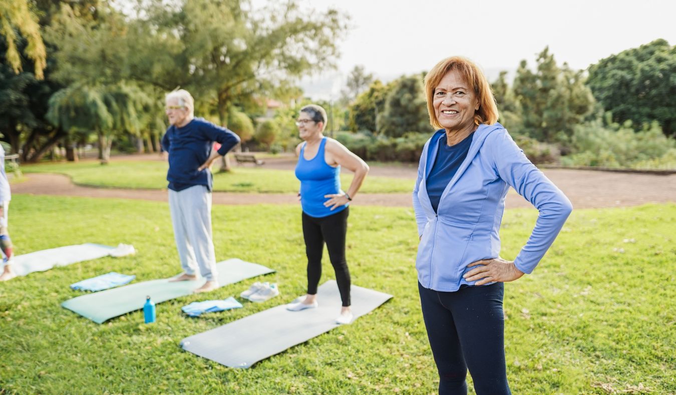 yoga seniors outside stretching