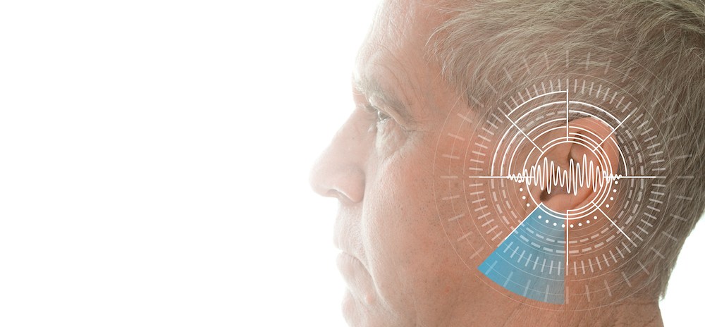 diagram of ear superimposed on man's head and ear