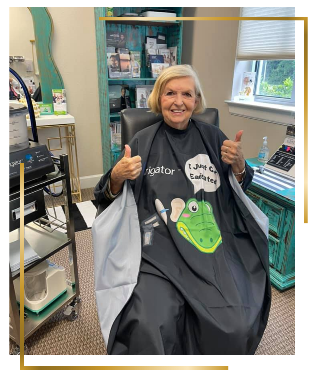 senior woman thumbs uping after earigator treatment