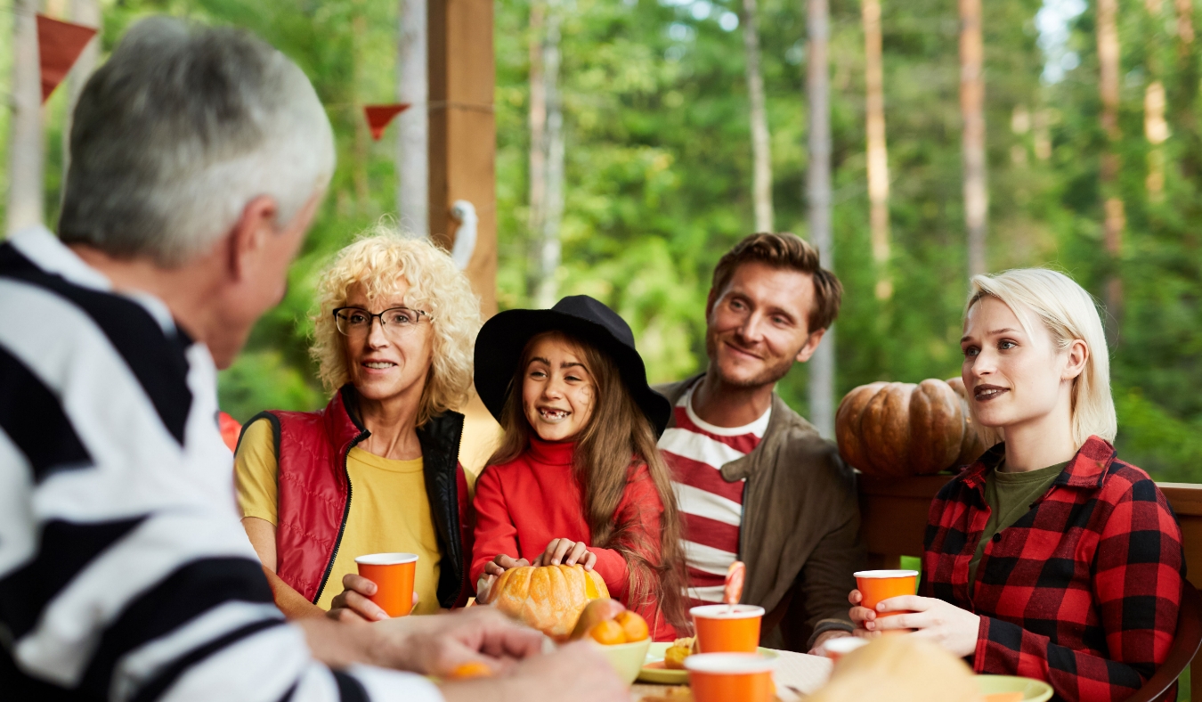 multi generations of family enjoy autumn meal