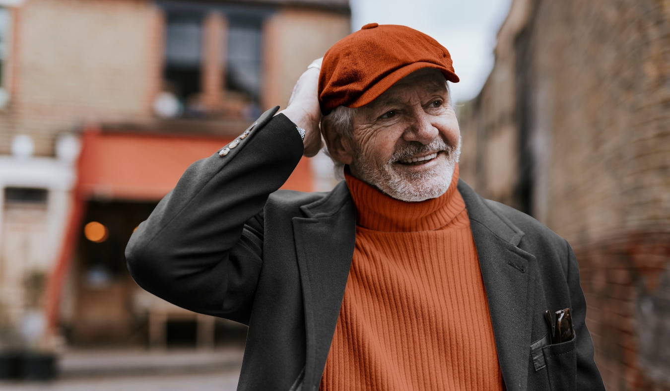senior man walking in city wearing autumn clothes