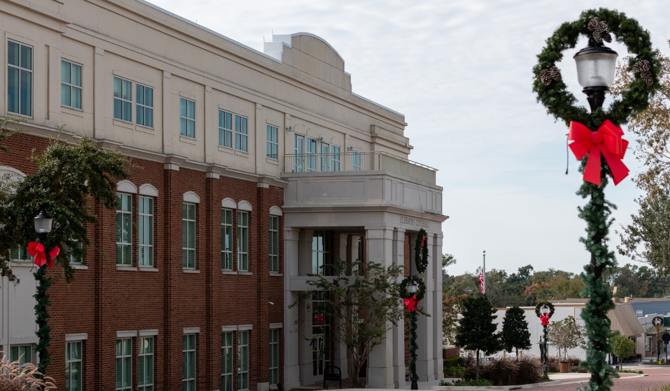 city decorated with greenery and wreaths for holidays