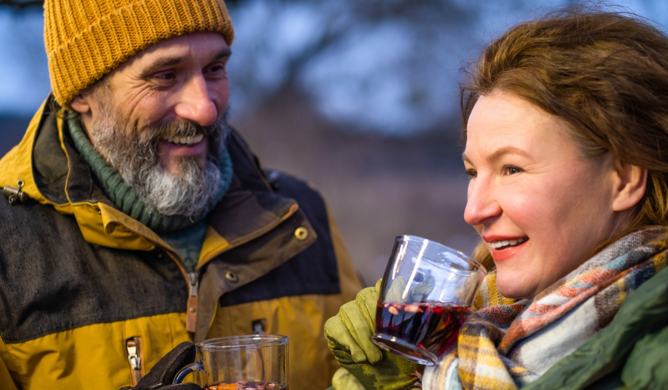 couple enjoying mulled hot drink