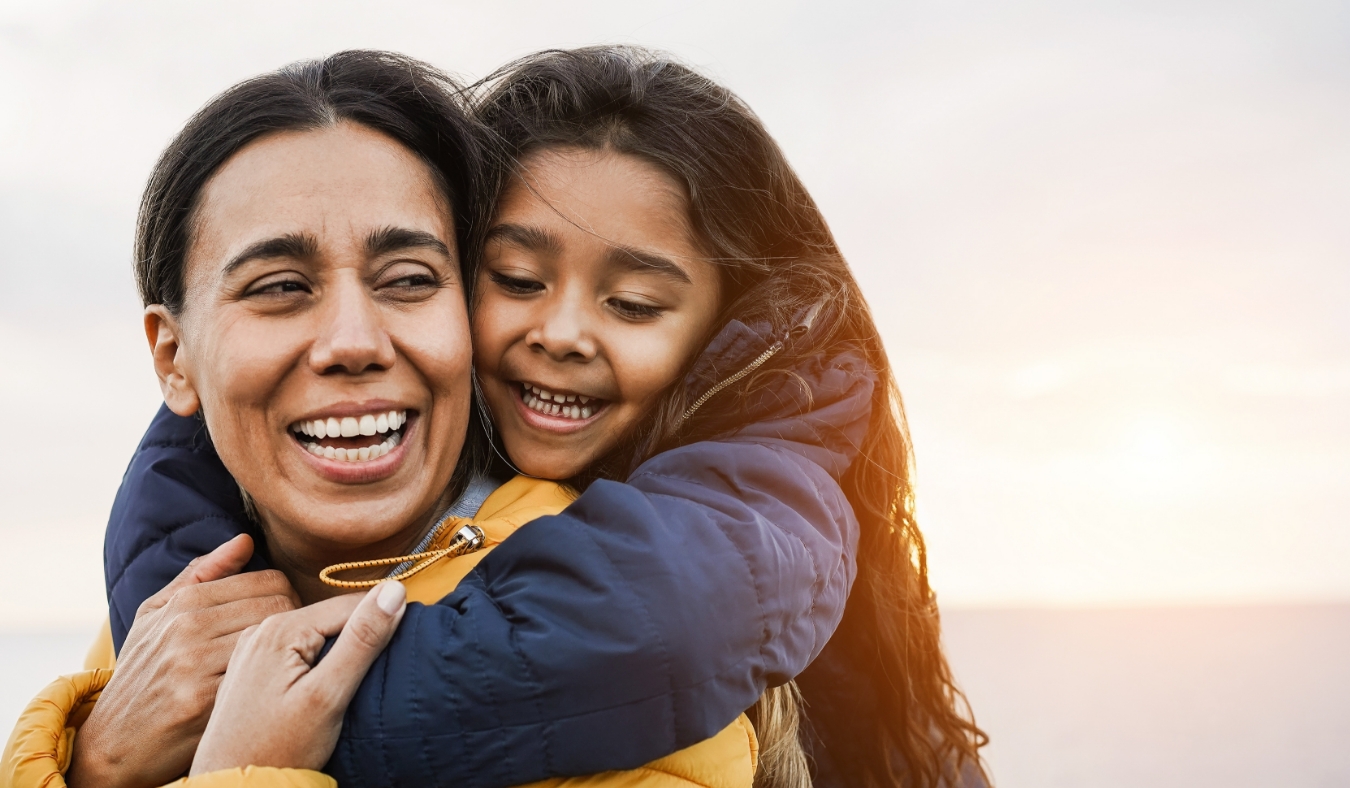 mother and daughter having fun together during winter time