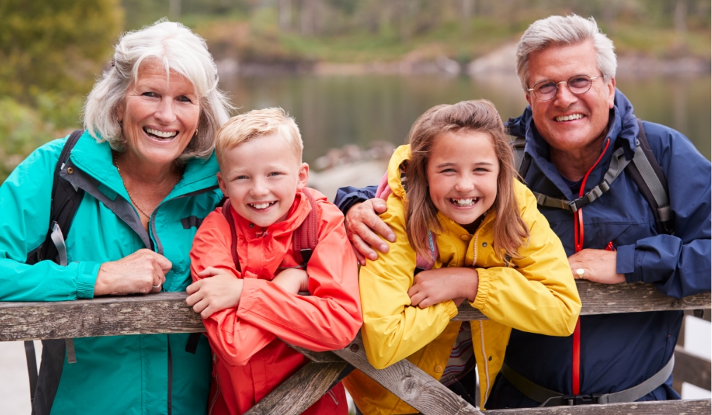 summer grandparents grandkids hiking lakeside