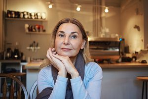 closeup image of woman in coffee shop