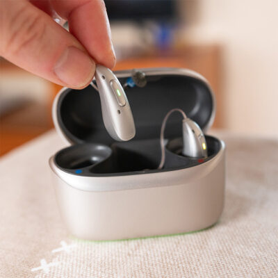 microsite product brands closeup hearing aids in charger 400x400