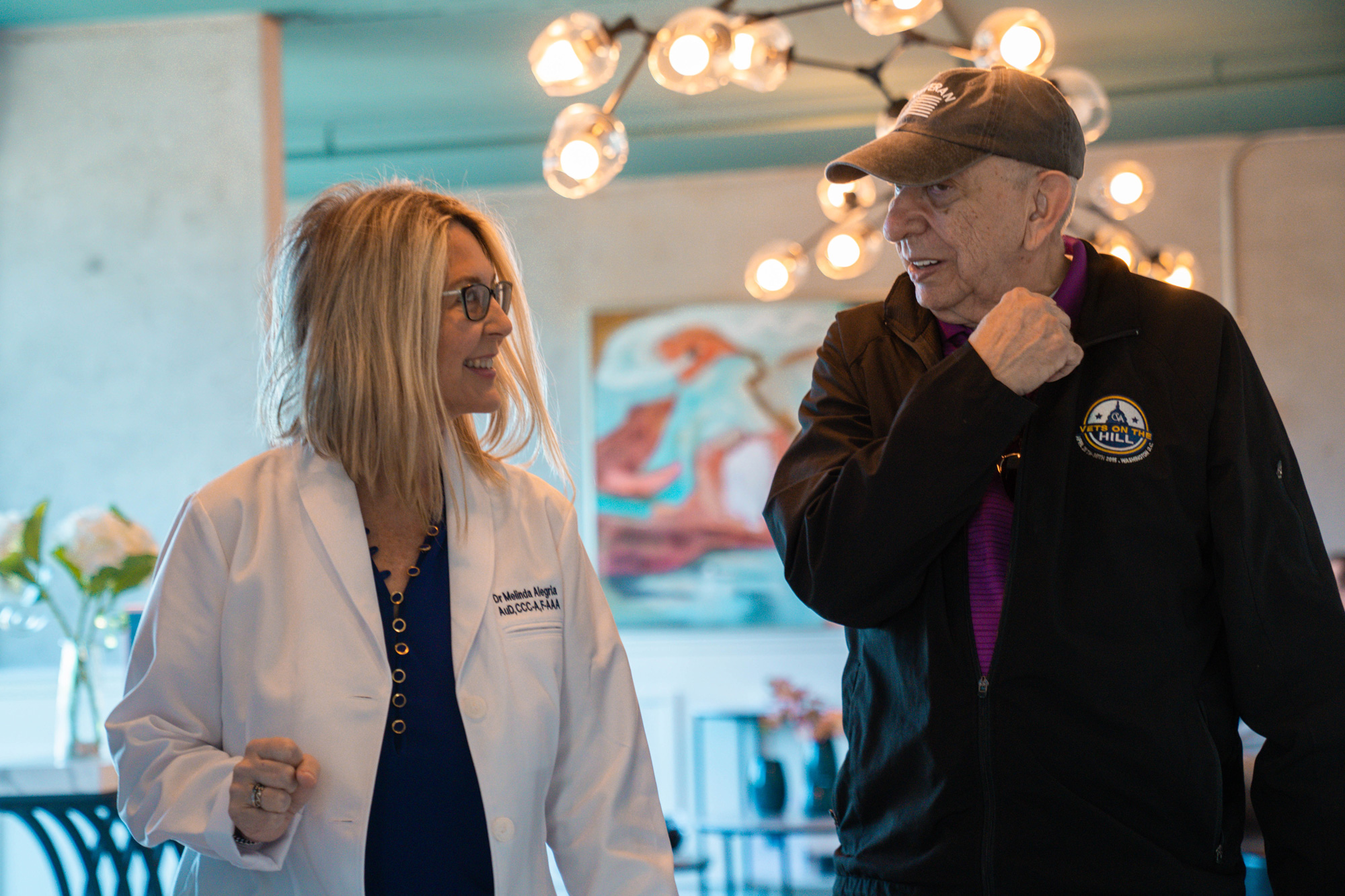 veteran patient walking with Dr Alegria to hearing consultation 124615