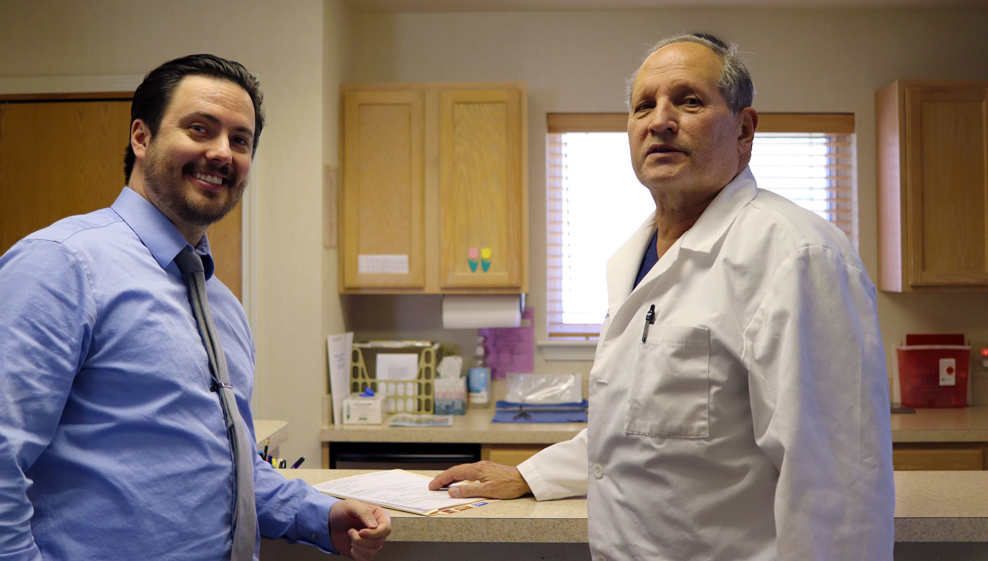 hearing care providers standing in office smiling