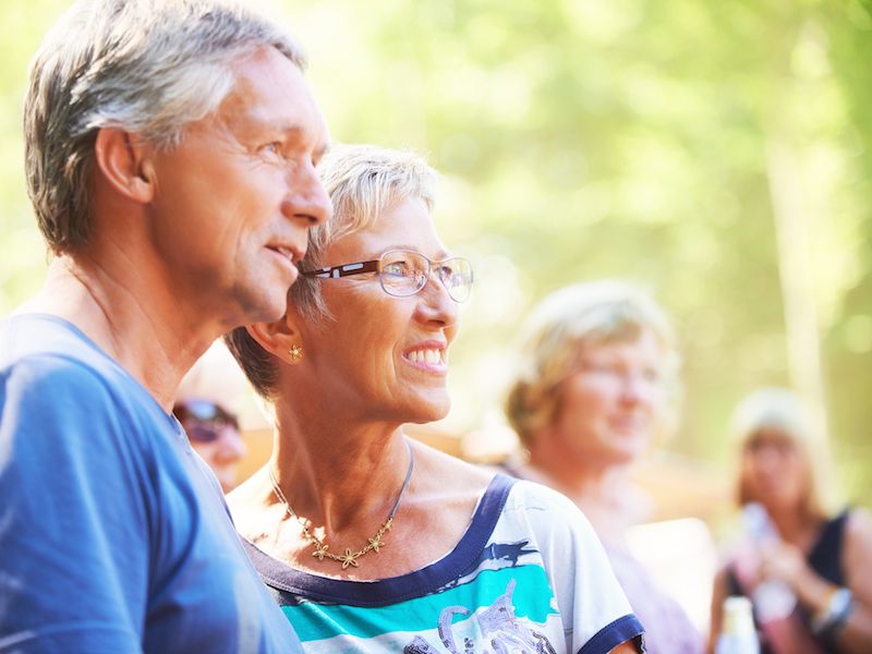 older mana nd woman standing together