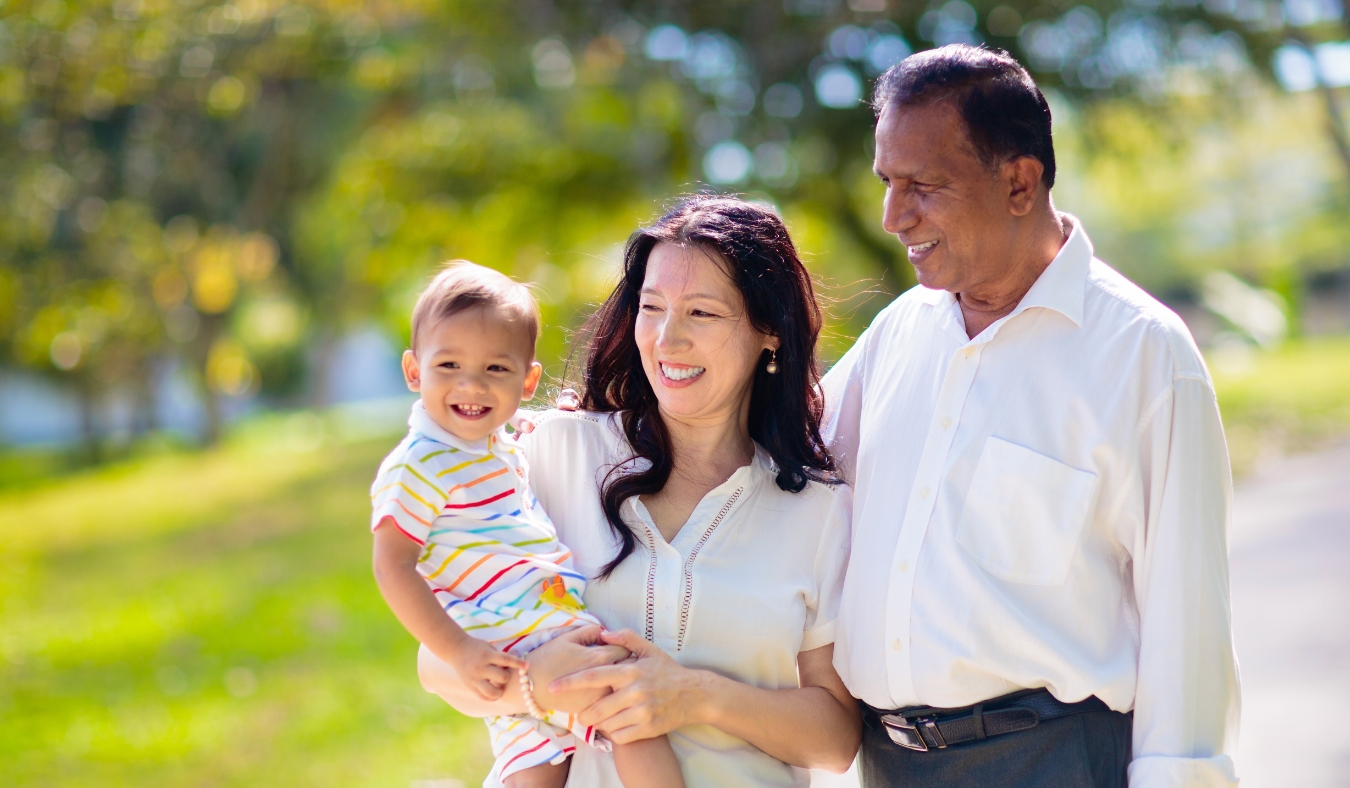 Family walking in summer park
