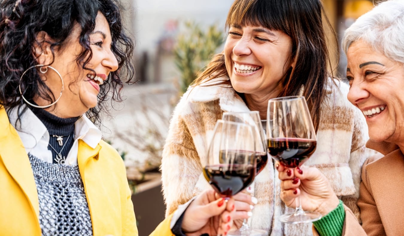 senior friends cheersing on a cold winter day