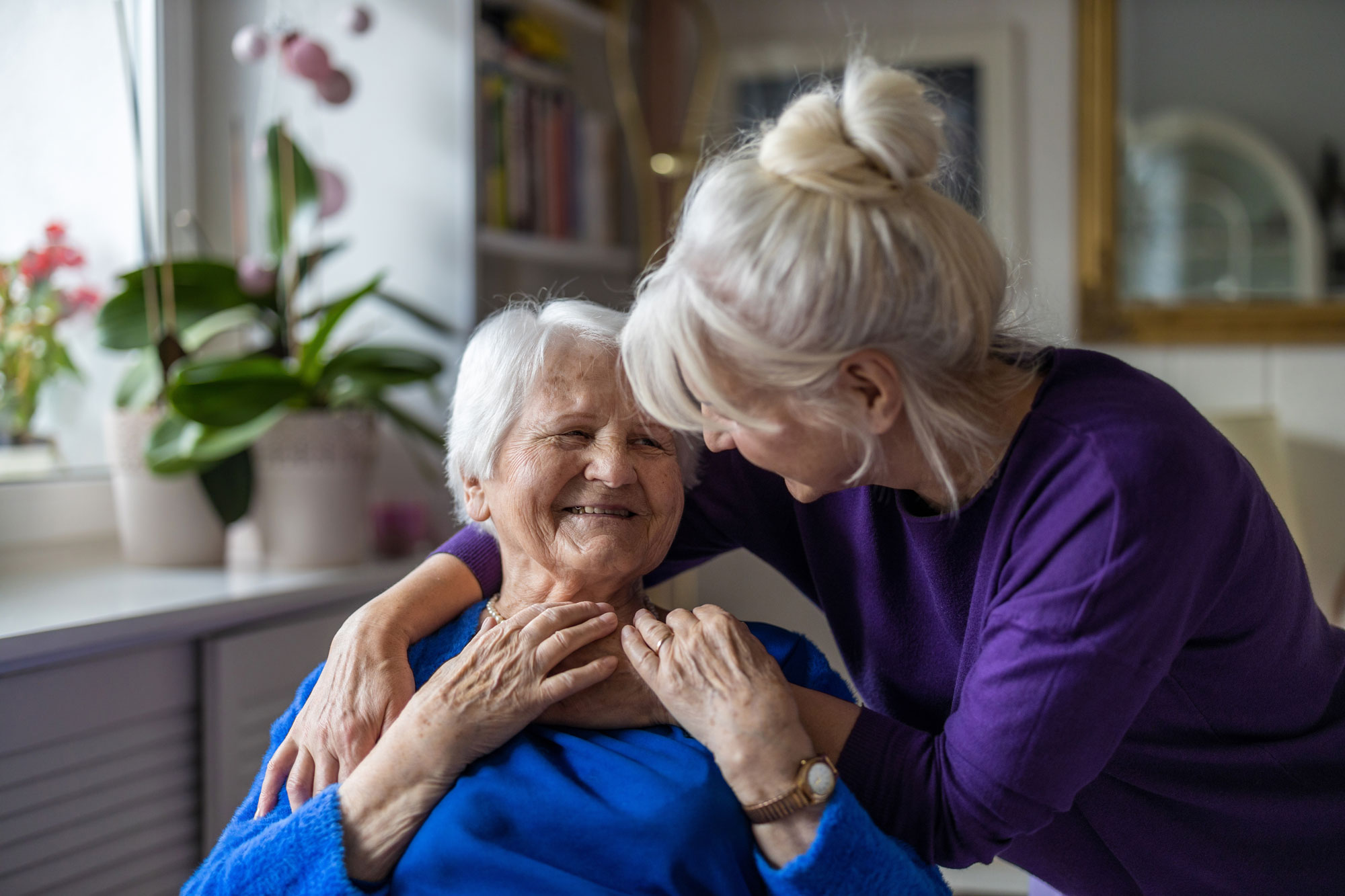 senior mother and daughter embracing
