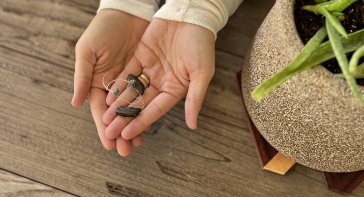 dr hinson holding hearing aids dr hinson holding hearing aids