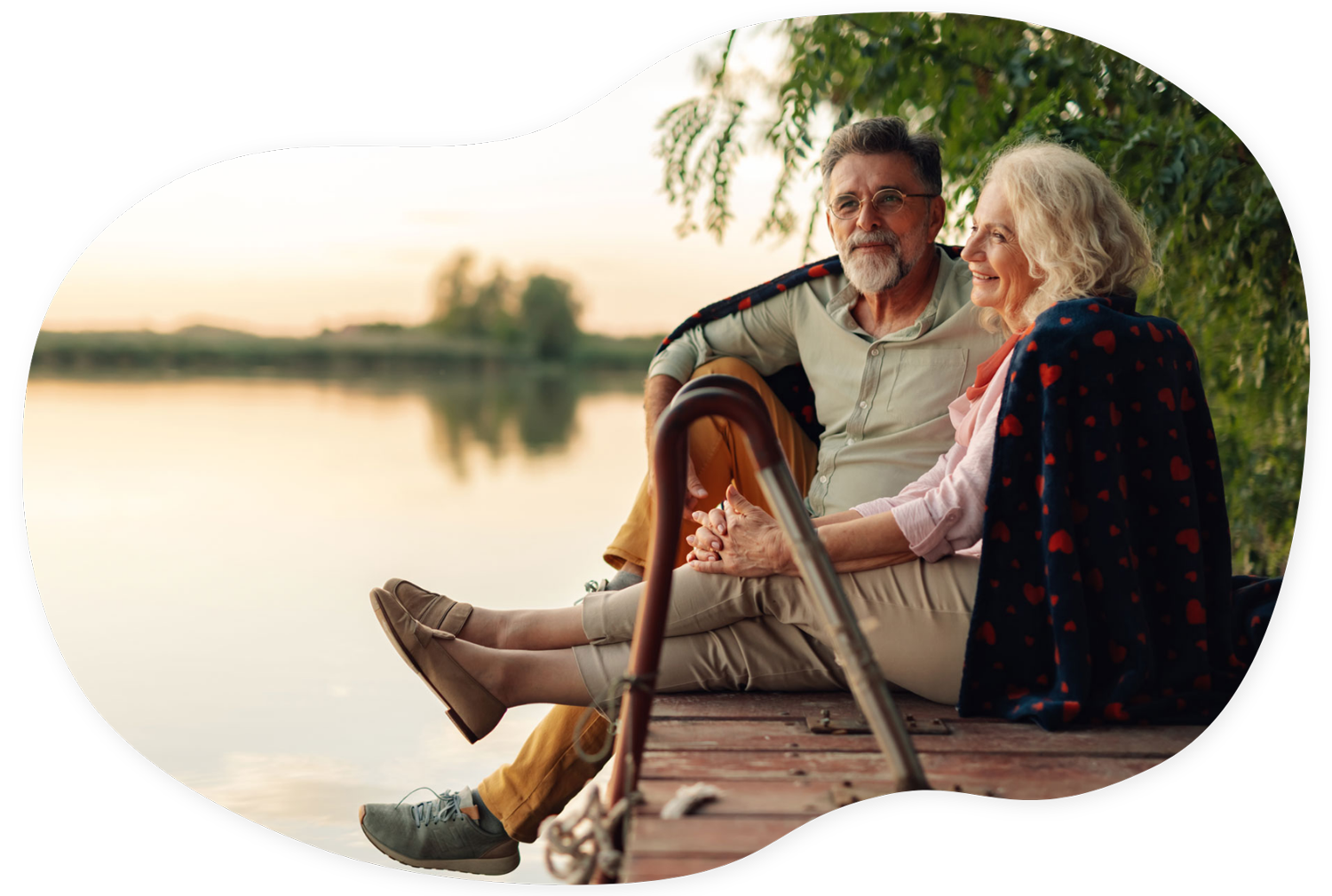 hero seniors on dock admiring lake at sunset
