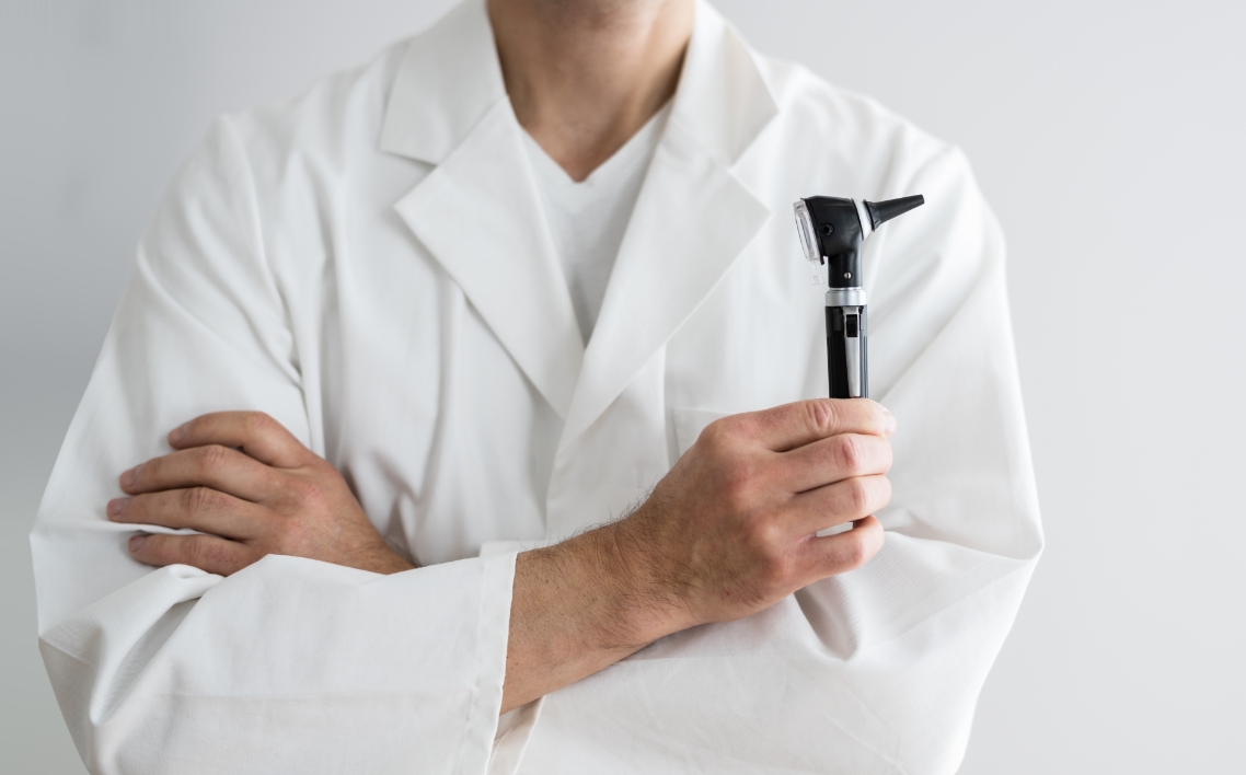 staff introduction image professional holding otoscope