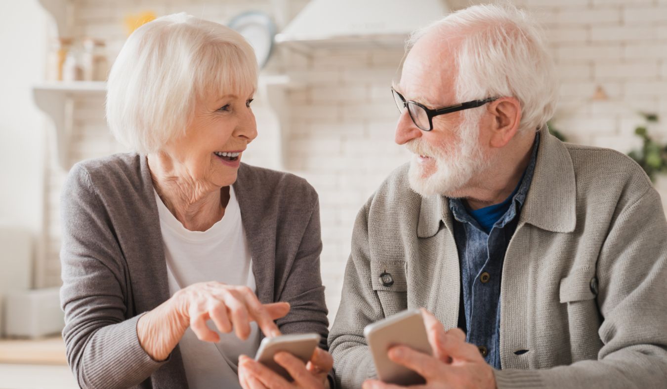 senior couple talking using phones