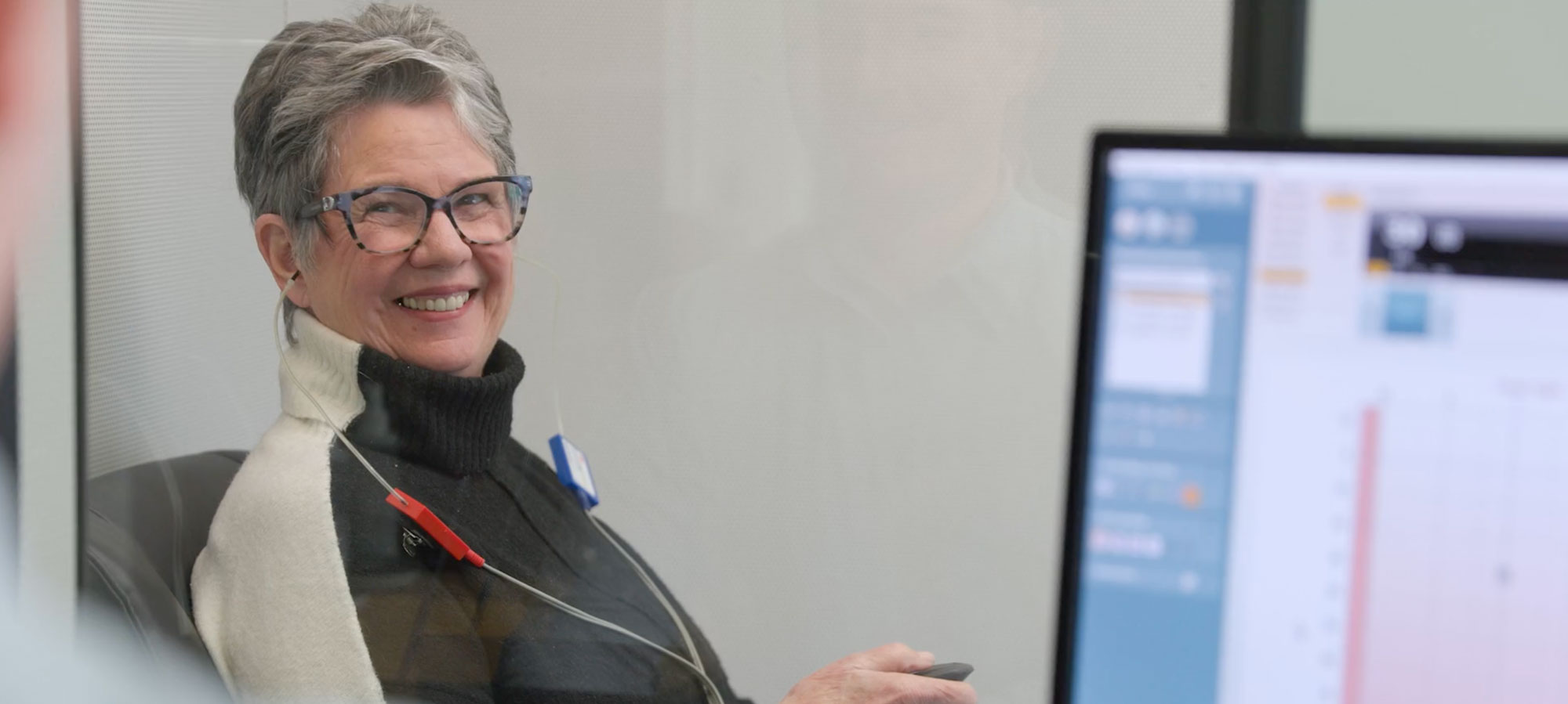 hearingcareclinic2 patient smiling during hearing test