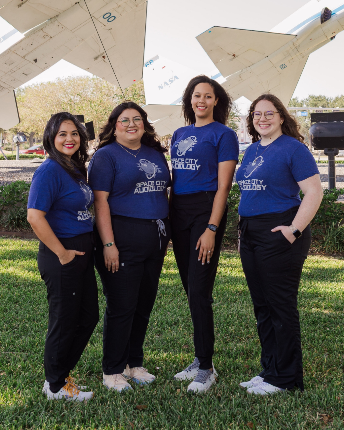 Space City Audiology 122 staff outside by planes