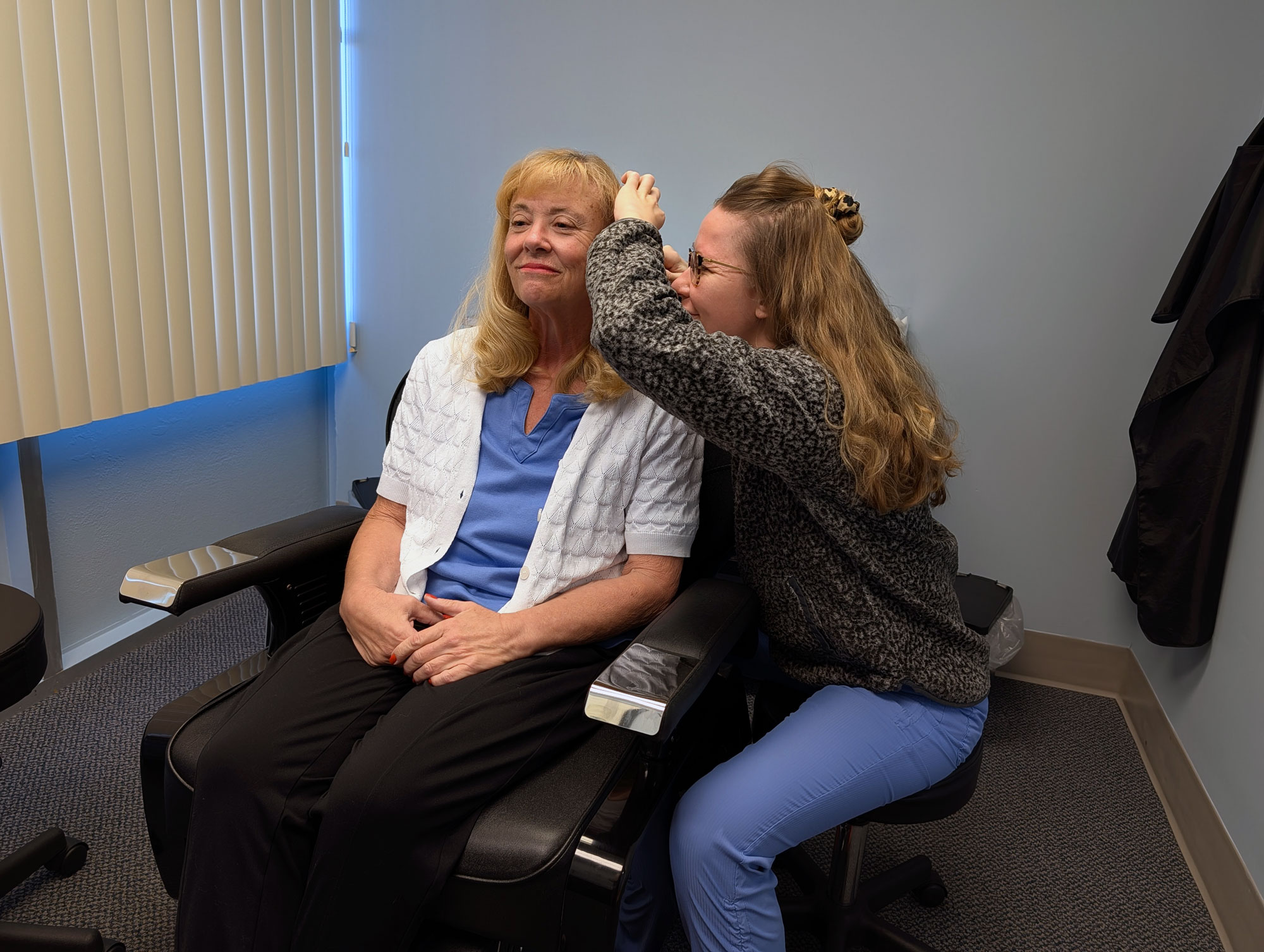 ear examination on patient