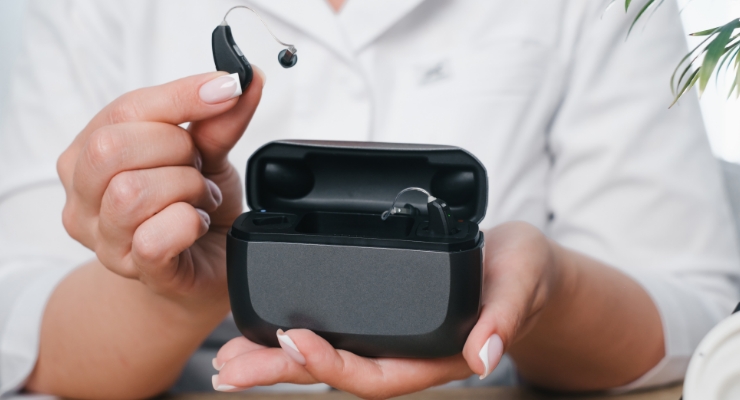 cta stacked prfoessional holding rechargable hearing aids