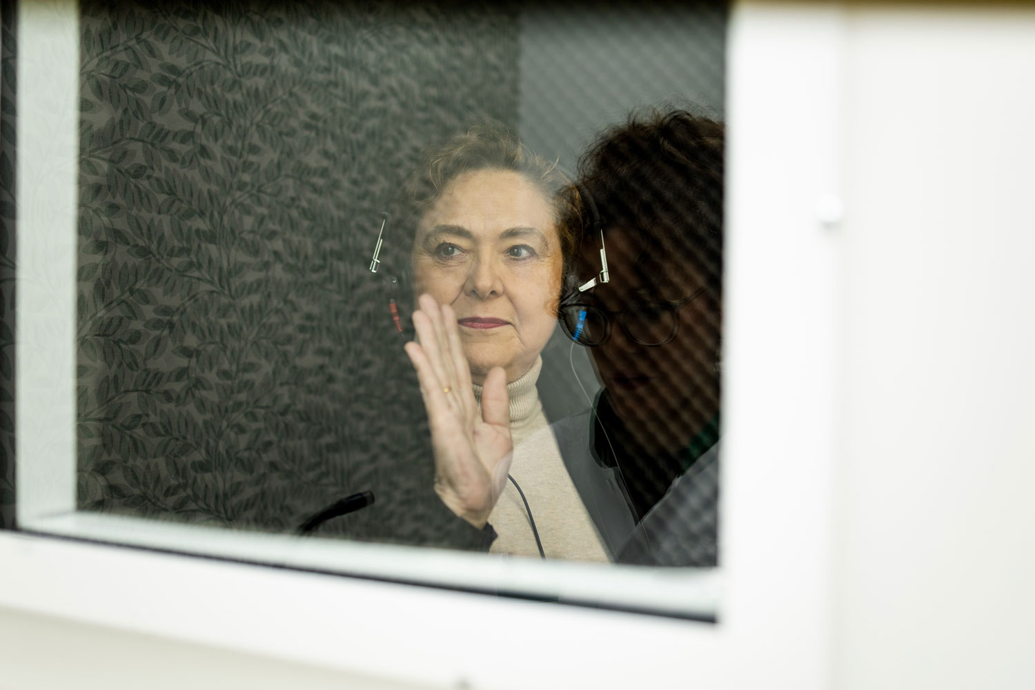 60 year old woman undergoes hearing tests