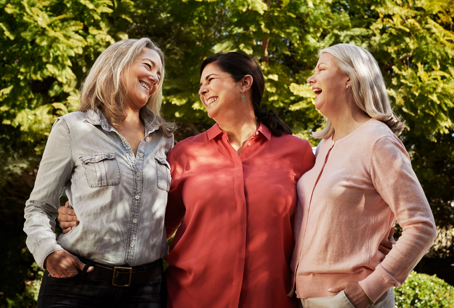 senior friends outside laughing