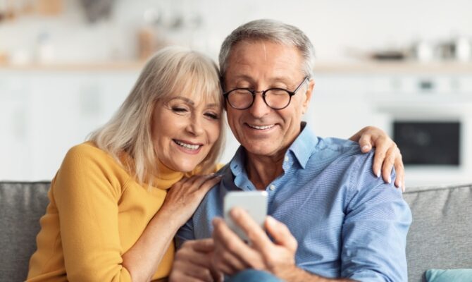 cta stacked senior couple using cell phone