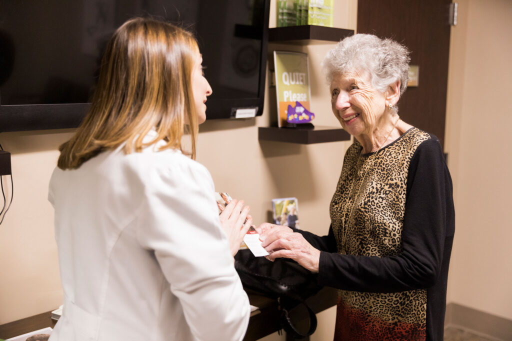 The Hearing Center provider handing out brochure