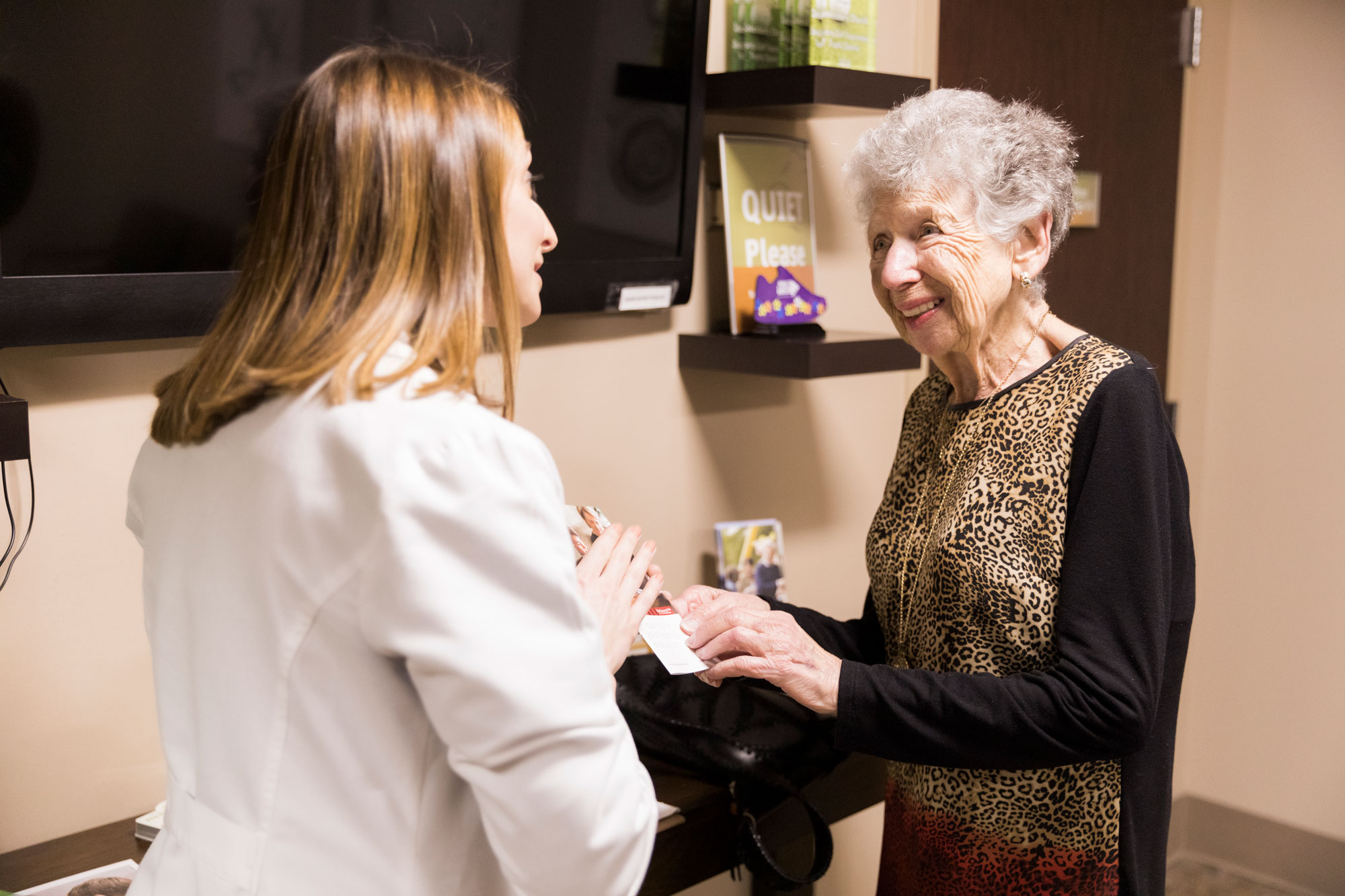 The Hearing Center provider handing out brochure
