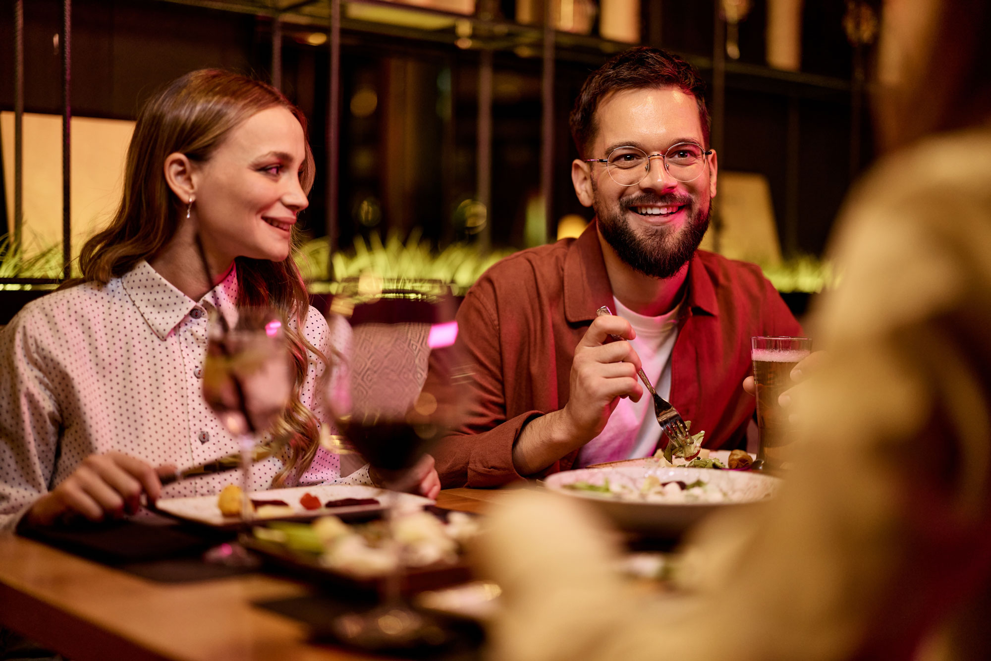Group of friends enjoying dinner and drinks