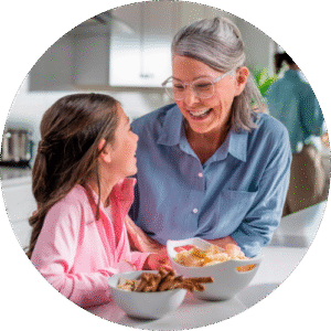 grandma making lunch with granddaughter