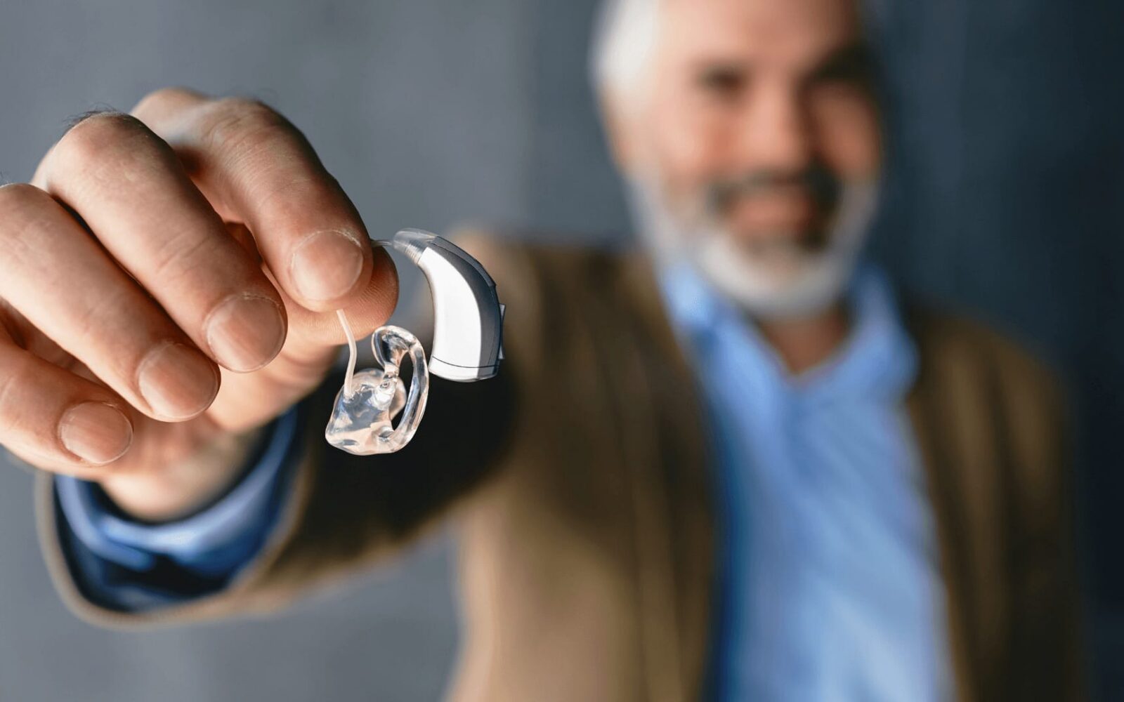 BIGSTOCK optimized man showing hearing aids