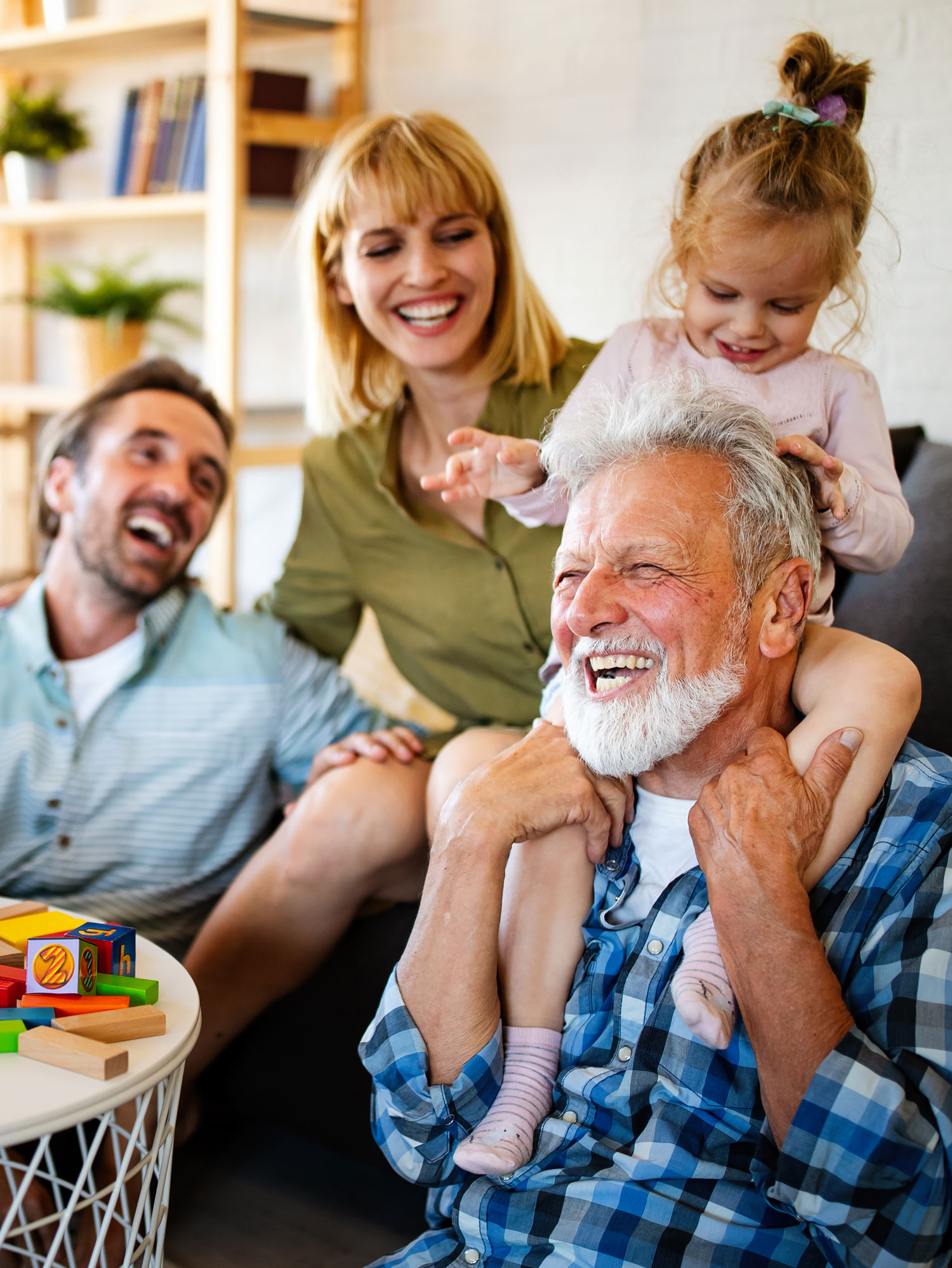 senior grandparents playing with grandchildren