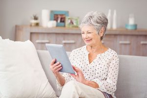 smiling woman using an ipad
