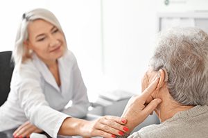 senior woman at hearing appointment with audiologist