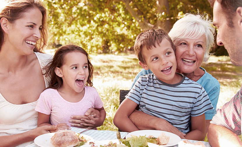 family-outdoor-lunch-at-table