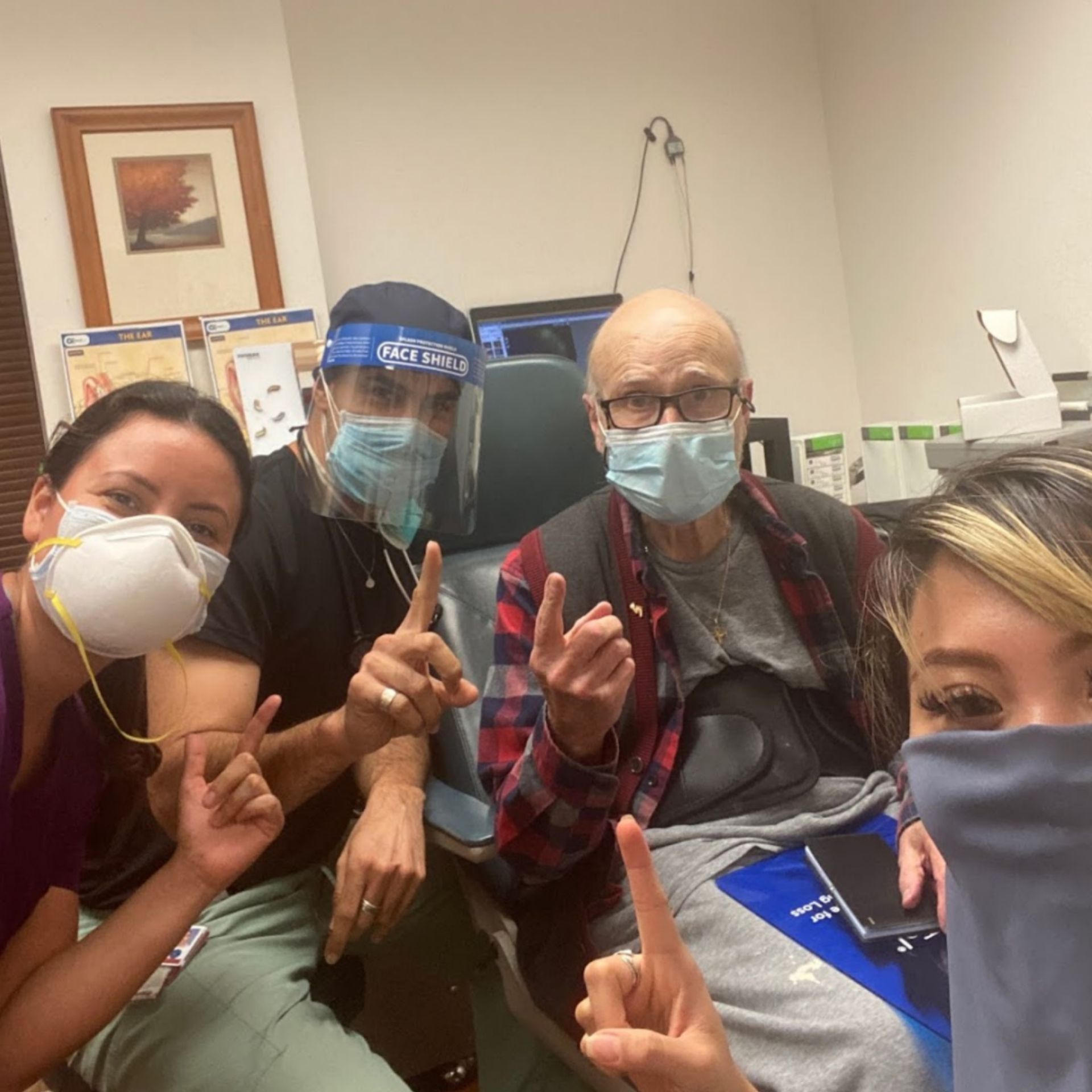 Andres Godinez Au D posing with patients
