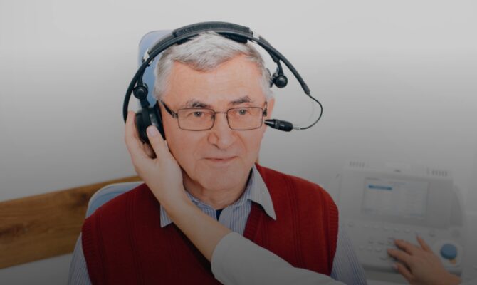 cta hover older man taking hearing test