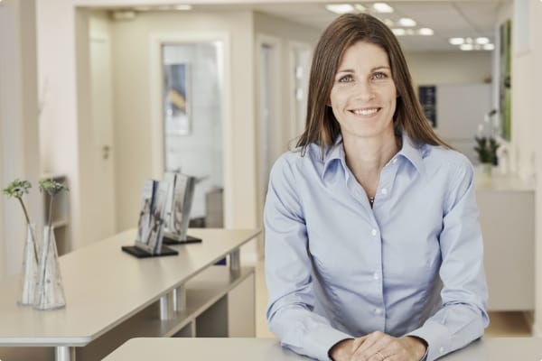 beltone woman at desk