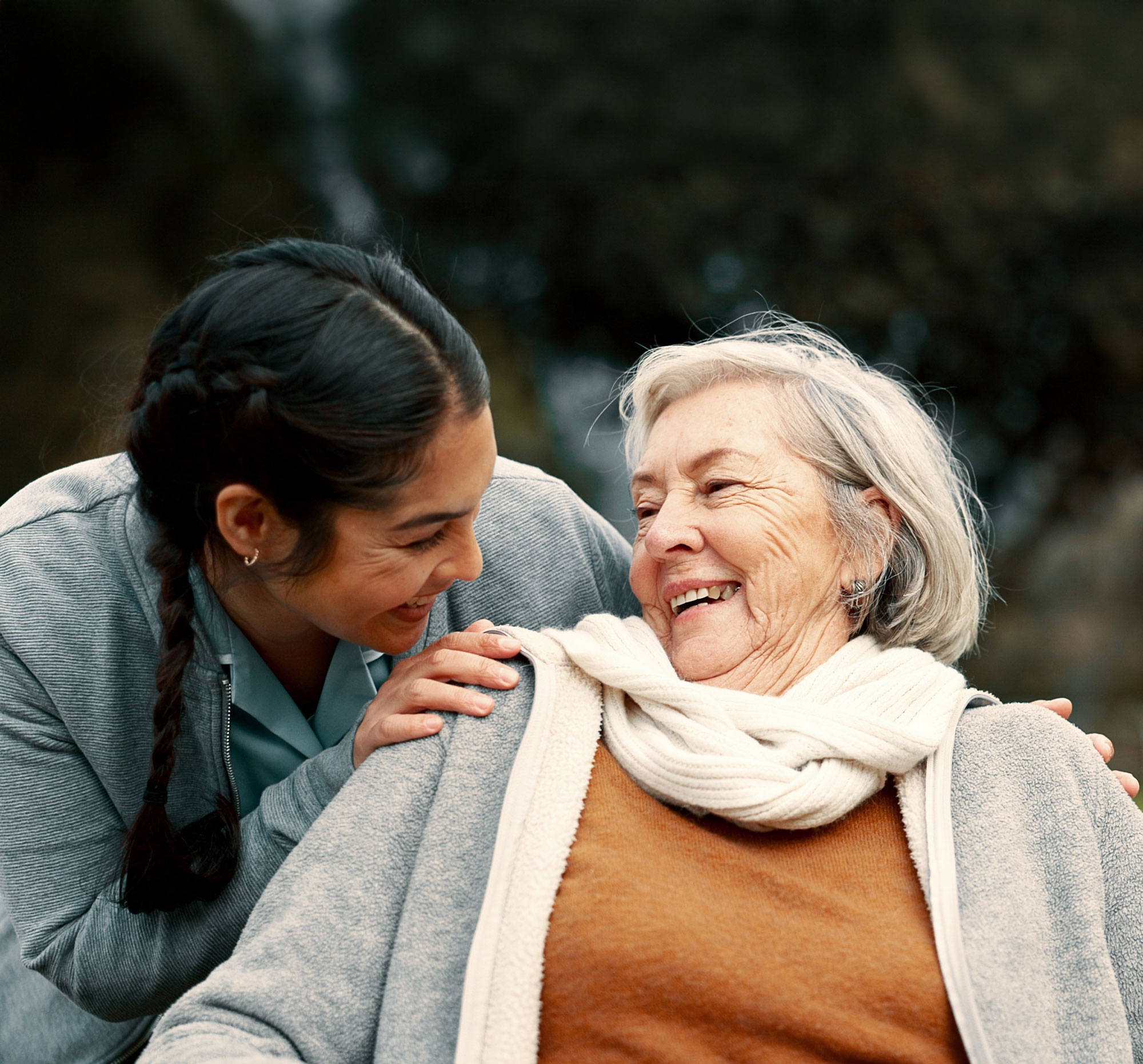 granddaughter and grandmother smiling towards each other