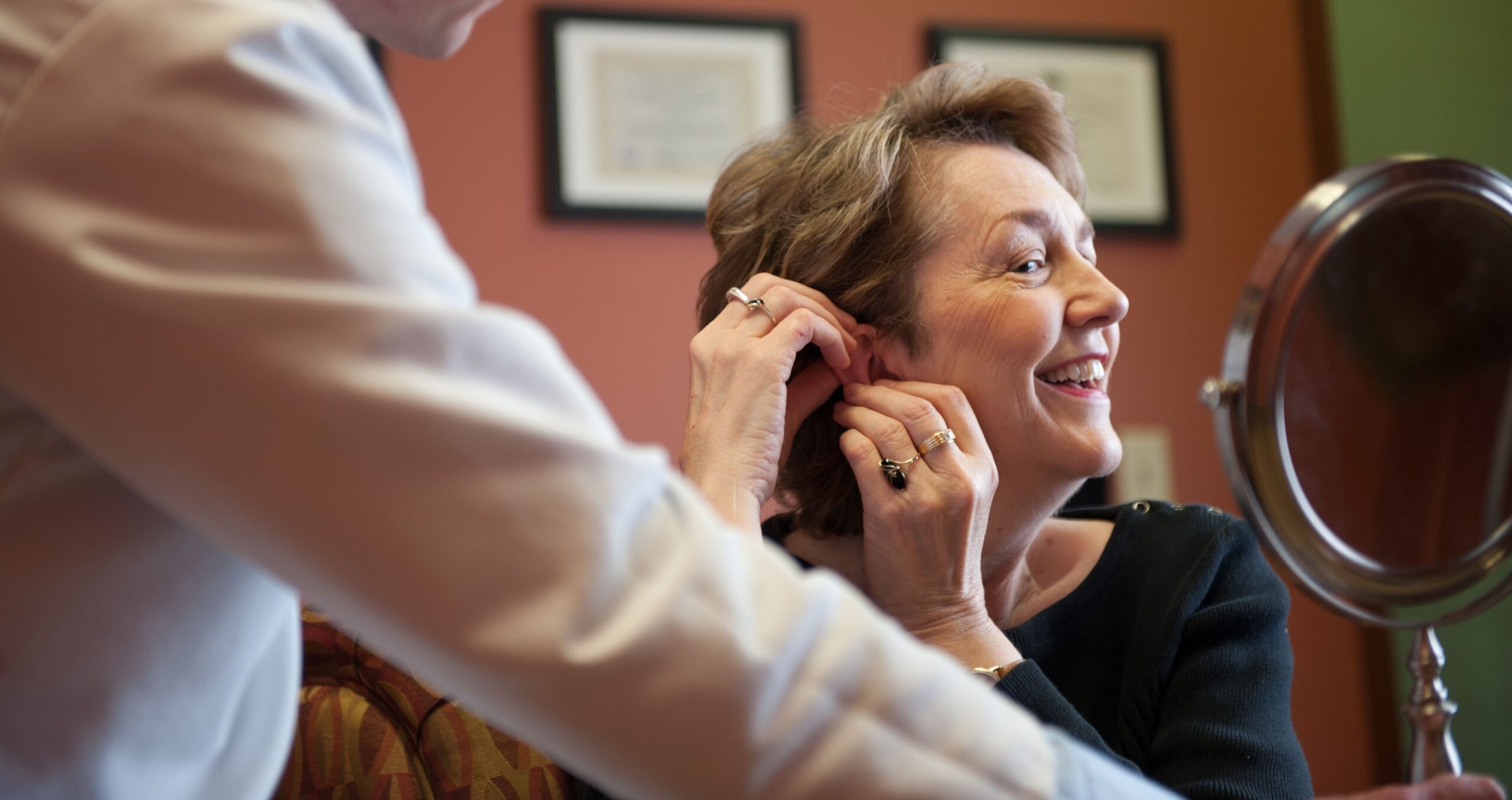 women hearing aid try on