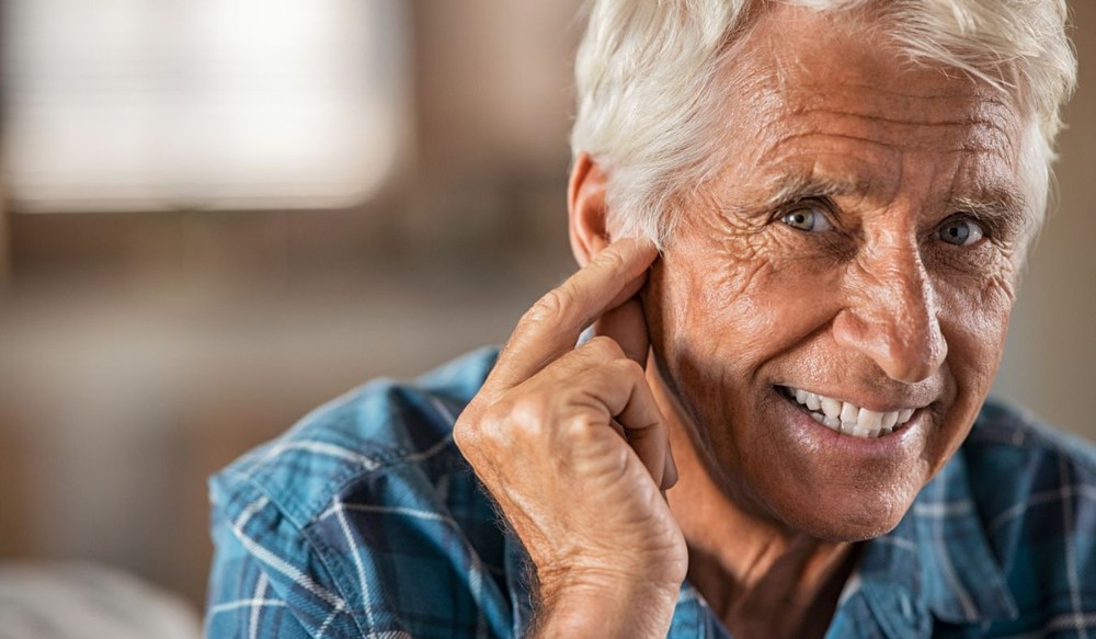 ears senior man hand to ear