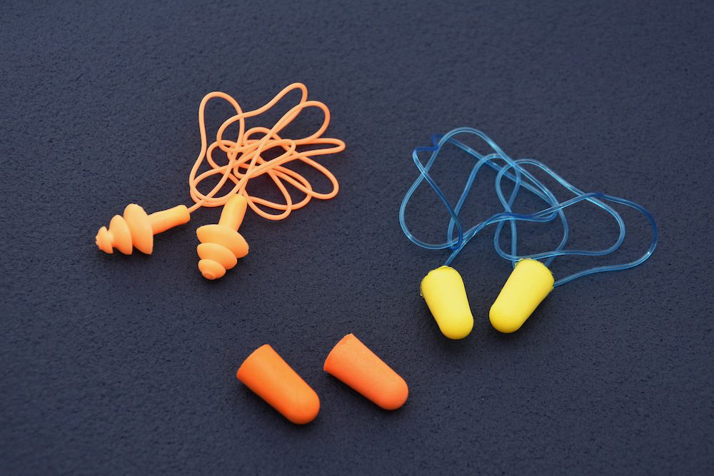 three sets of silicon and foam earplugs