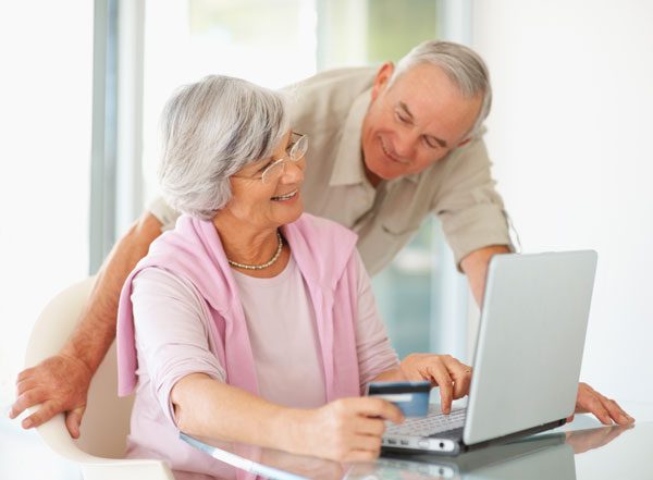 a couple searching for info on a laptop