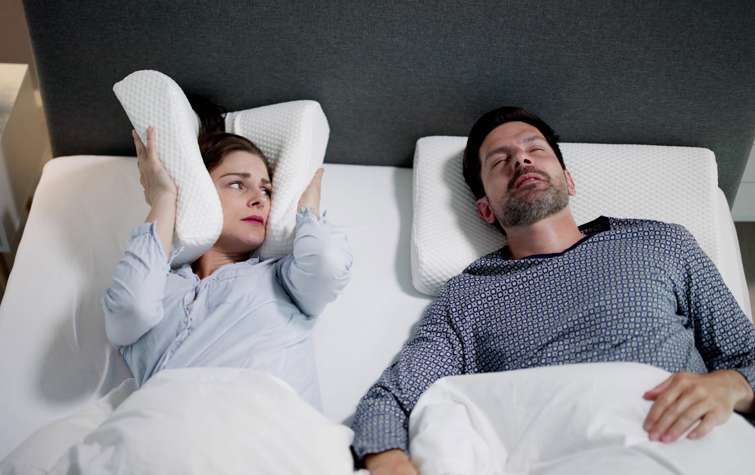 Snoring Man Sleeping With Apnea And Sleepless Woman